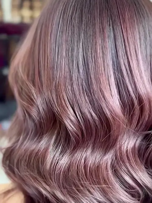 Rose pink hair in glossy waves