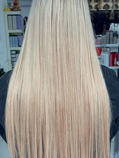 Long, straight blonde nano bead hair extensions